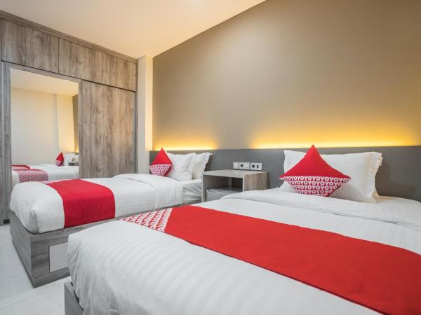 Super OYO 1487 Residence Khoe : photo 2 de la chambre chambre lits jumeaux supérieure