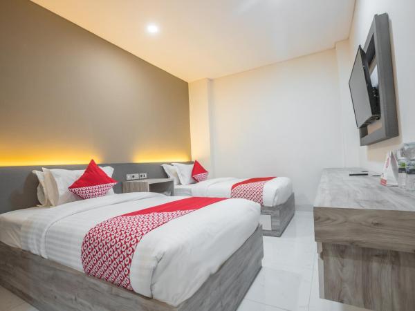 Super OYO 1487 Residence Khoe : photo 1 de la chambre chambre lits jumeaux supérieure
