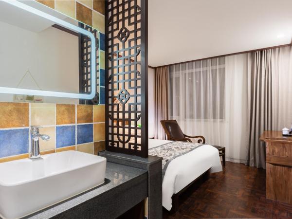 Time Traveller Hotel - Near Tianjin Polar Ocean World, Tianjin Fonte Joy World, 10 minutes drive away from Tianjin Tanggu High-Speed Railway Station, Free ice-cream, mineral water, snacks and laundry service, English communication well : photo 1 de la chambre chambre simple