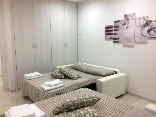 La casa di Donatella : photo 9 de la chambre chambre quadruple avec salle de bains commune