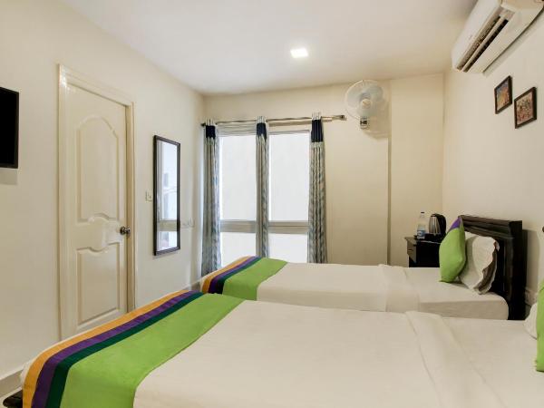 Treebo Srico : photo 5 de la chambre [sanitized] standard double room