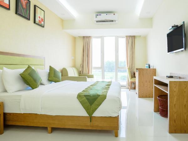 Treebo The Galaxy Chandapura : photo 1 de la chambre [sanitized] deluxe double room