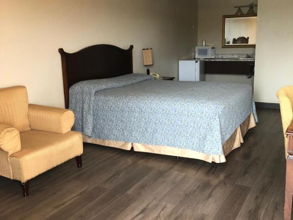 Red Deer Inn & Suites : photo 1 de la chambre chambre lit queen-size