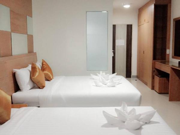 The Greenery central suite & hotel : photo 1 de la chambre chambre triple deluxe