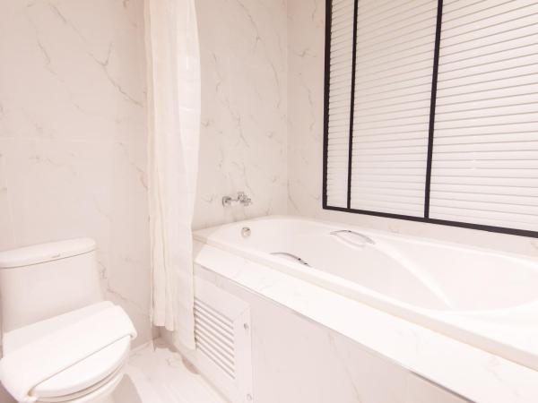 Madison Bangkok Hotel : photo 5 de la chambre chambre lits jumeaux - vue sur jardin