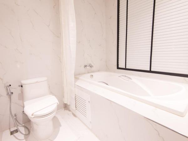 Madison Bangkok Hotel : photo 6 de la chambre chambre lits jumeaux - vue sur jardin