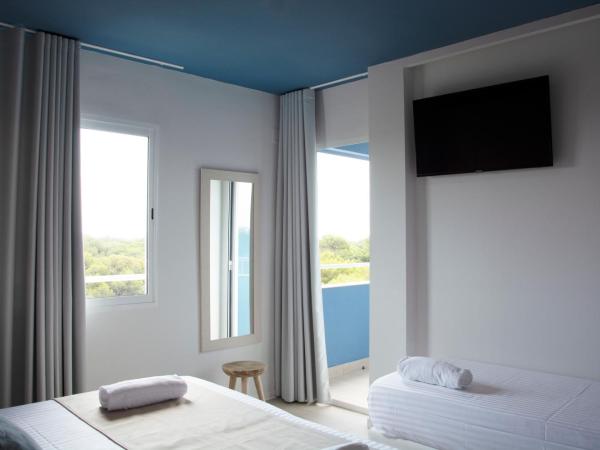 YOU & CO. Saler Beach Boutique : photo 2 de la chambre chambre triple