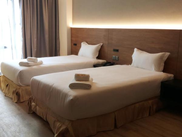Roxy Hotel Padungan : photo 1 de la chambre chambre lits jumeaux deluxe