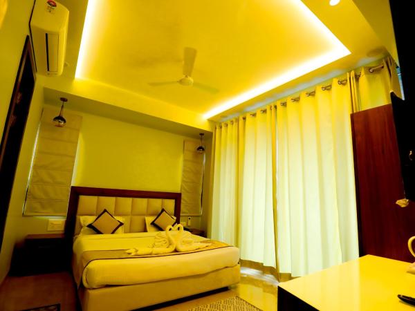 Taj Sojourn : photo 5 de la chambre chambre lit king-size - vue sur jardin