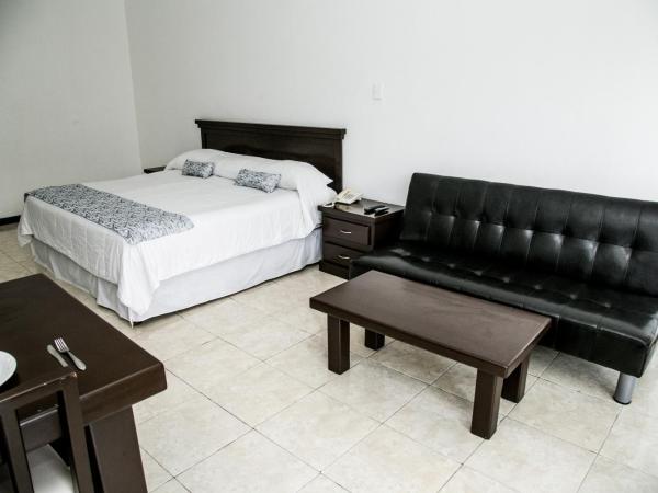 Booking Dioh : photo 2 de la chambre suite lit king-size avec balcon