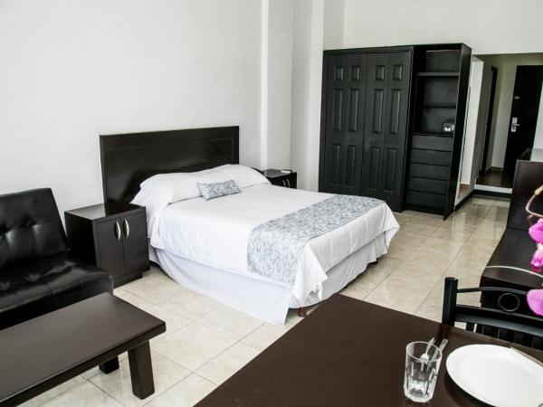 Booking Dioh : photo 1 de la chambre suite lit king-size avec balcon