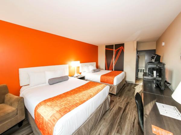 Howard Johnson by Wyndham Winnipeg West : photo 1 de la chambre chambre avec 2 lits queen-size - rez-de-chaussée - non-fumeurs/entrée privée extérieure