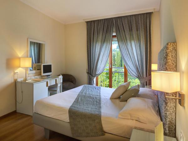 Hotel Regina : photo 2 de la chambre chambre double ou lits jumeaux - vue sur jardin