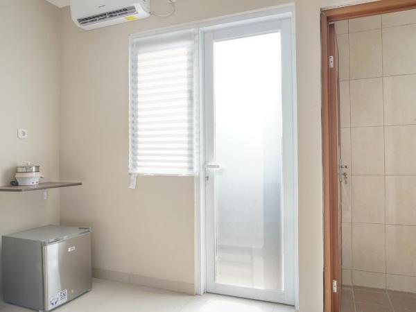 Residences by RedDoorz near MT Haryono - Minimum Stay 7 Days : photo 7 de la chambre chambre lits jumeaux