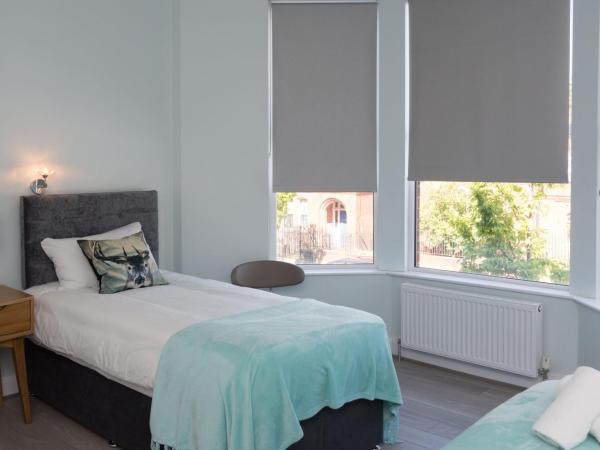 Titanic Guest Boutique, 4-Star Accommodation : photo 1 de la chambre chambre triple avec douche