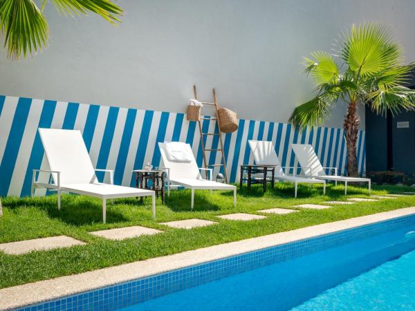 Maison Cabral : photo 2 de la chambre chambre lit queen-size - vue sur jardin