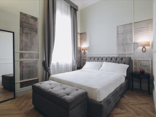 Gregorini Bingham Art Luxury Suites : photo 1 de la chambre suite deluxe avec lit king-size