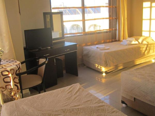 Hotel Melike : photo 1 de la chambre chambre triple avec balcon