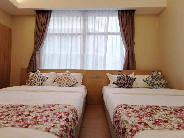 Oikos Poshtel : photo 2 de la chambre chambre exécutive avec 2 lits queen-size