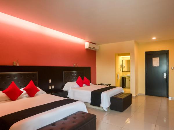 Capital O Veracruz Suites : photo 1 de la chambre chambre double standard avec 2 lits doubles