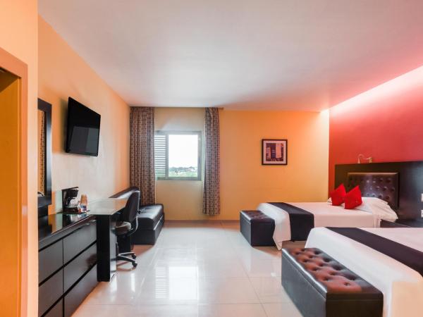 Capital O Veracruz Suites : photo 2 de la chambre chambre double standard avec 2 lits doubles