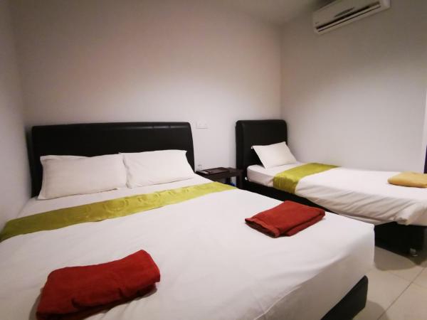 Clover Hotel Port Dickson : photo 3 de la chambre chambre triple deluxe