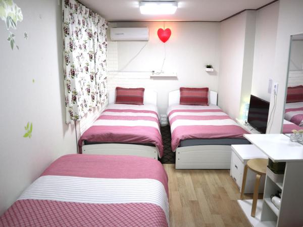 Jeong House : photo 2 de la chambre chambre triple avec salle de bains commune