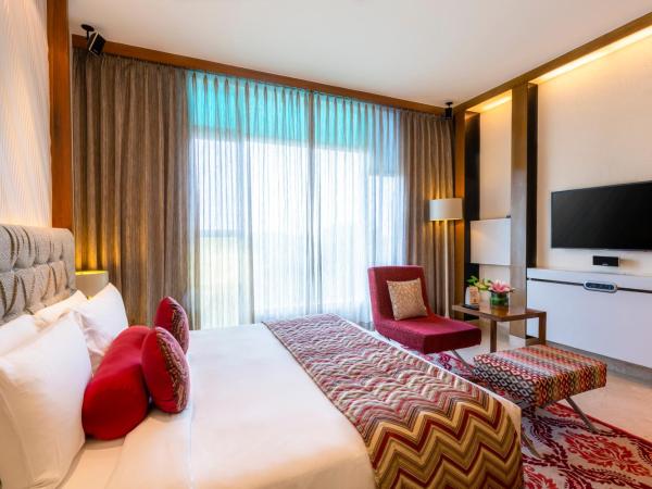 Vivanta Bengaluru, Whitefield : photo 4 de la chambre deluxe room garden view queen bed