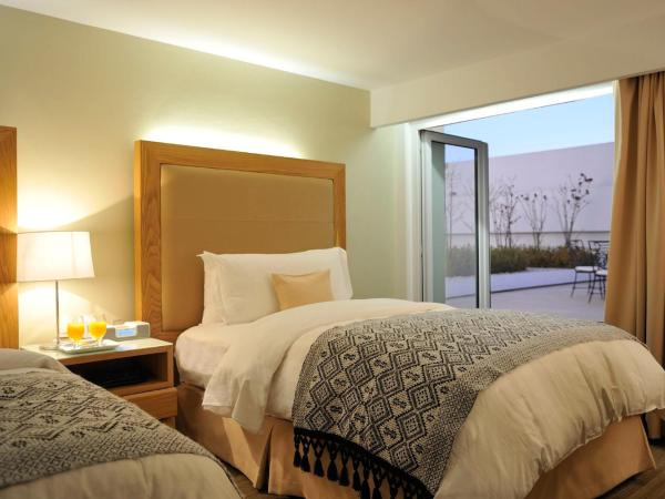 Presidente Intercontinental Puebla, an IHG Hotel : photo 3 de la chambre chambre lits jumeaux classique avec accès au salon