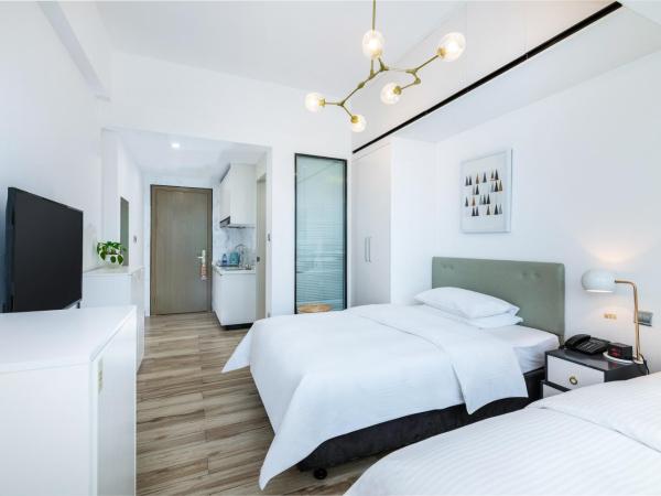 深圳金中环服务公寓-深业上城店 Golden Central Serviced Residence Shenzhen-UpperHills : photo 2 de la chambre chambre lits jumeaux exécutive