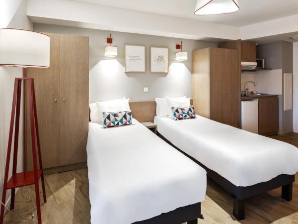 Appart'City Confort Mulhouse : photo 1 de la chambre studio avec 2 lits simples