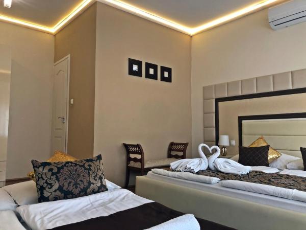 Melior Szálló : photo 5 de la chambre chambre quadruple en duplex