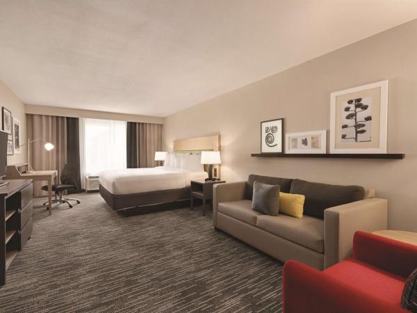 Country Inn & Suites by Radisson, Savannah Midtown, GA : photo 1 de la chambre suite 1 chambre lit king-size avec canapé-lit - non-fumeurs