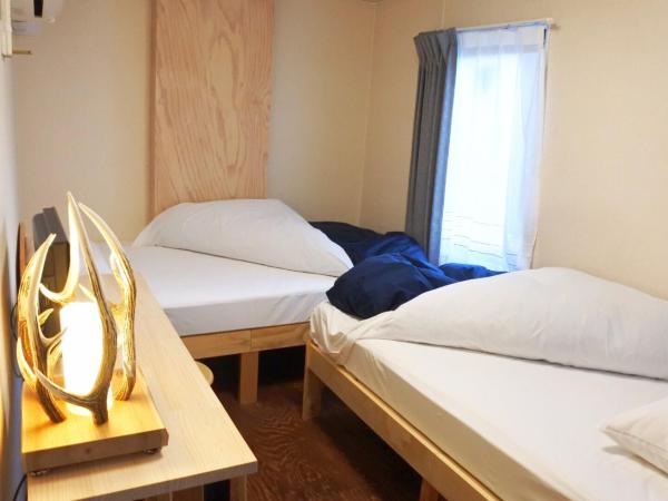 SappoLodge : photo 3 de la chambre chambre lits jumeaux avec salle de bains