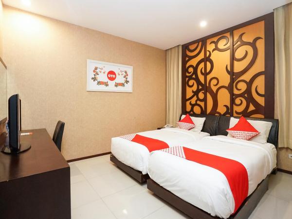 Collection O 252 Istana Permata Ngagel : photo 1 de la chambre chambre lits jumeaux standard