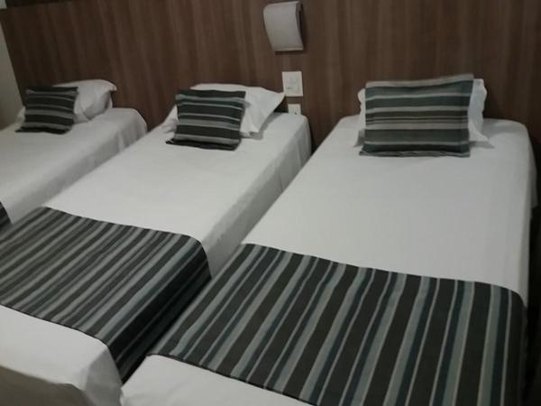 Allia Gran Pampulha Suites : photo 4 de la chambre chambre triple de luxe