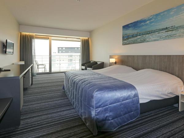 Vayamundo Oostende : photo 2 de la chambre chambre lits jumeaux avec vue latérale sur la mer


