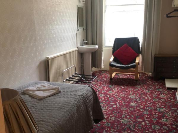 Atlas Guest House : photo 3 de la chambre chambre simple avec salle de bains commune