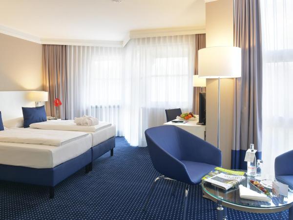 relexa Waldhotel Schatten Stuttgart : photo 1 de la chambre chambre simple deluxe