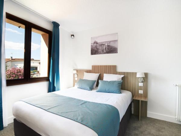 Maison des Croisades : photo 1 de la chambre chambre double ou lits jumeaux - vue sur jardin
