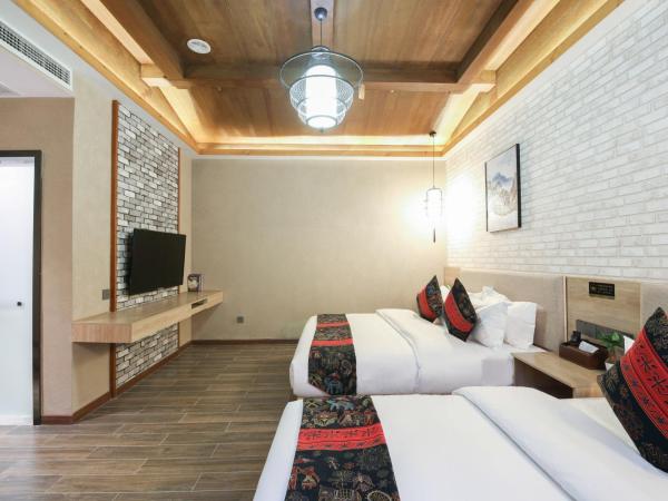 Zou Qu Ye Travel Hotel : photo 4 de la chambre chambre lits jumeaux Économique