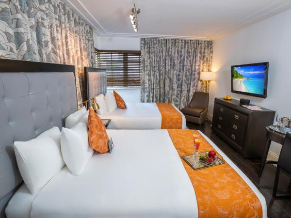 Riviera Suites : photo 1 de la chambre chambre avec 2 lits queen-size