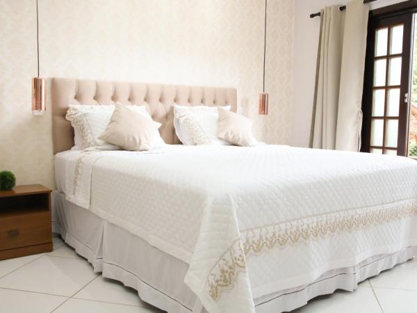 Casa Pedra Bonita : photo 4 de la chambre suite lit king-size avec baignoire spa