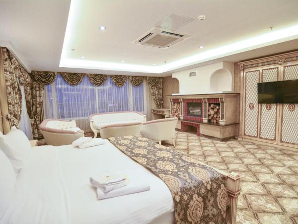 World Point Hotel Istanbul : photo 4 de la chambre suite lit king-size avec baignoire spa