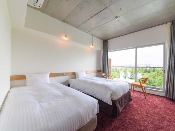 Hotel Lodge Maishima : photo 1 de la chambre chambre lits jumeaux standard avec vue sur jardin