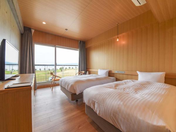 Hotel Lodge Maishima : photo 1 de la chambre chambre lits jumeaux - vue sur mer