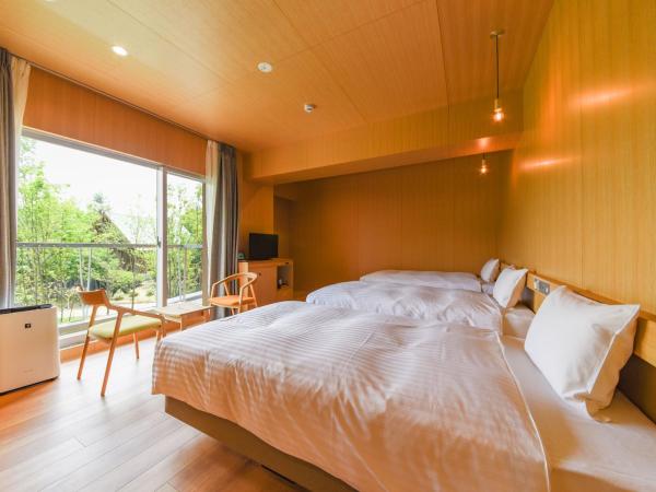 Hotel Lodge Maishima : photo 1 de la chambre chambre triple - vue sur jardin