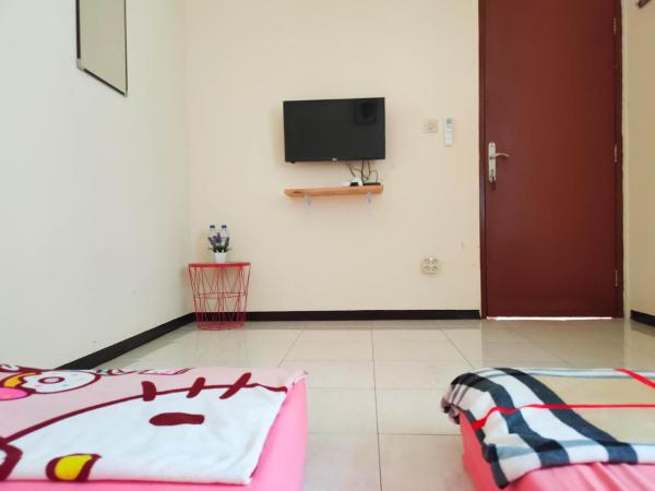Green Surabaya Homey : photo 1 de la chambre chambre lits jumeaux
