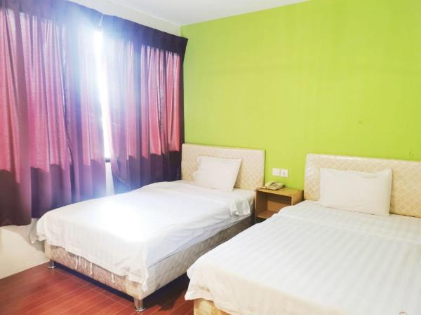 Homestay Kuching Hotel : photo 1 de la chambre chambre lits jumeaux standard