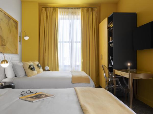 Angad Arts Hotel : photo 4 de la chambre chambre lit queen-size double - moyenne